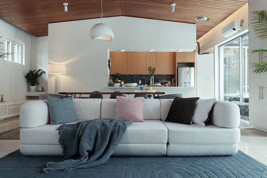 Flow boneless sofa bed in white fine weave in a modern living room