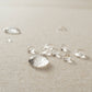 A close-up of water droplets on Rezy Sofa's sophisticated stain-resistant fabric